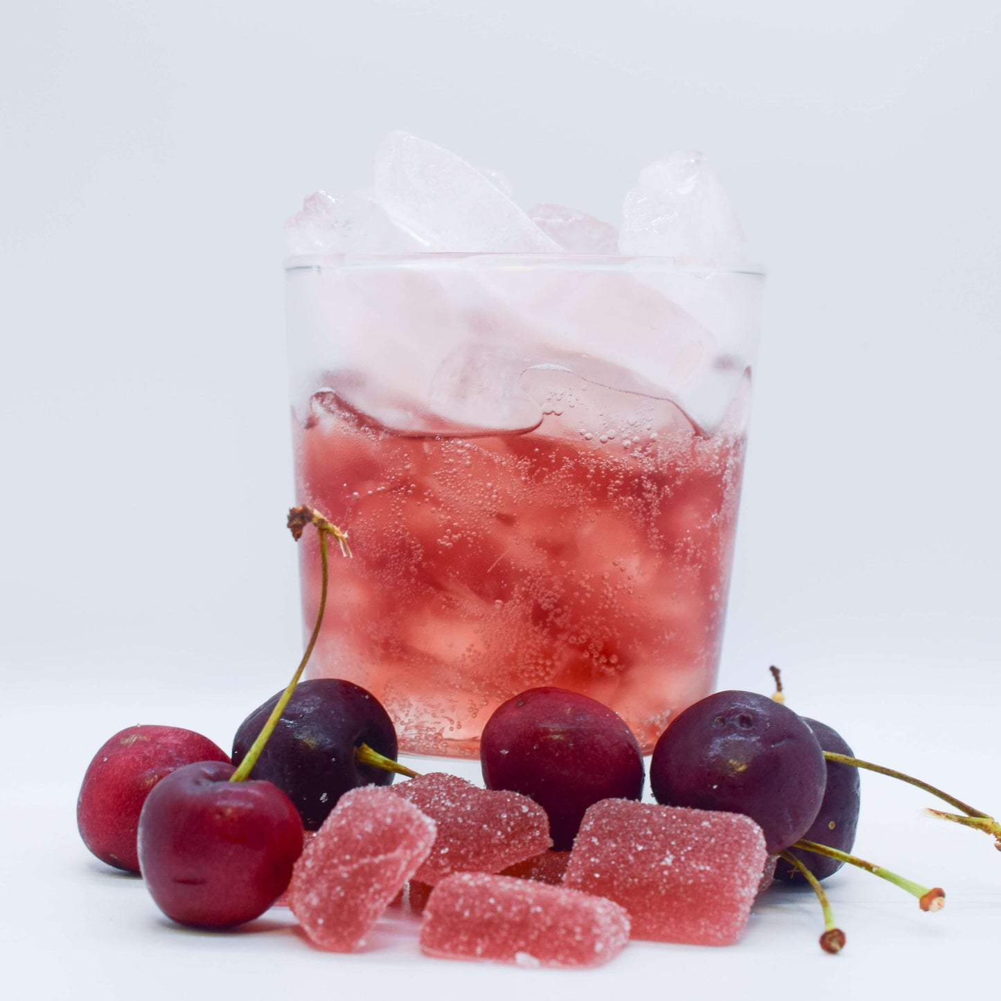 SUPERCHARGED - Fast-Acting 15mg THC Gummies with cherries and a refreshing drink.