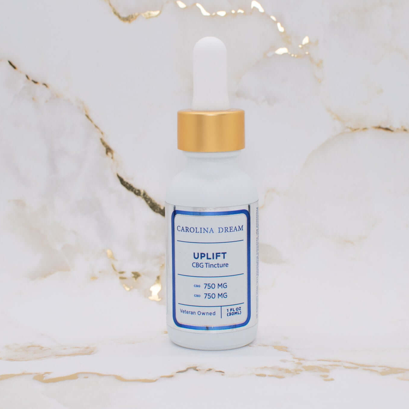 Uplift CBD CBG tincture bottle with 750mg each of CBD and CBG on a marble background.