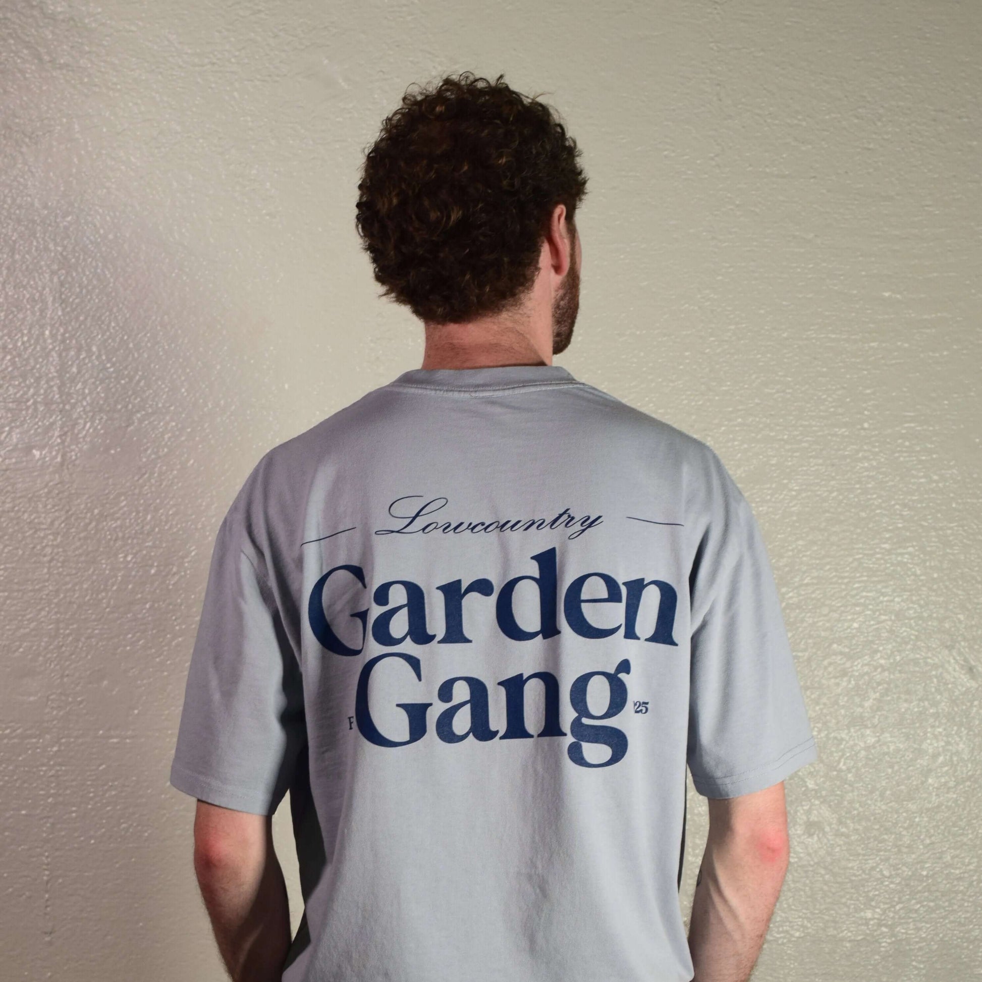 Lowcountry Garden Gang Tee Shirt featuring a stylish design on the back in gray cotton fabric.
