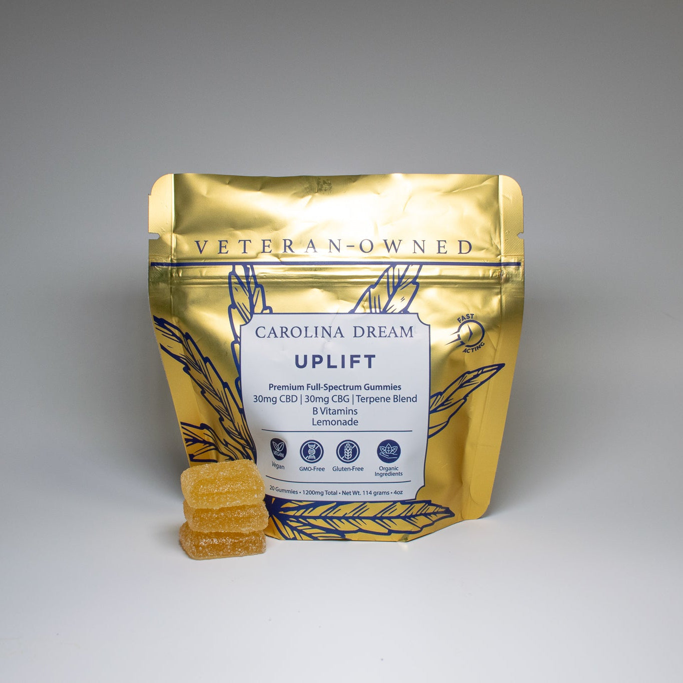 Carolina Dream Uplift gummies in front of the packaging for Carolina Dream Uplift gummies