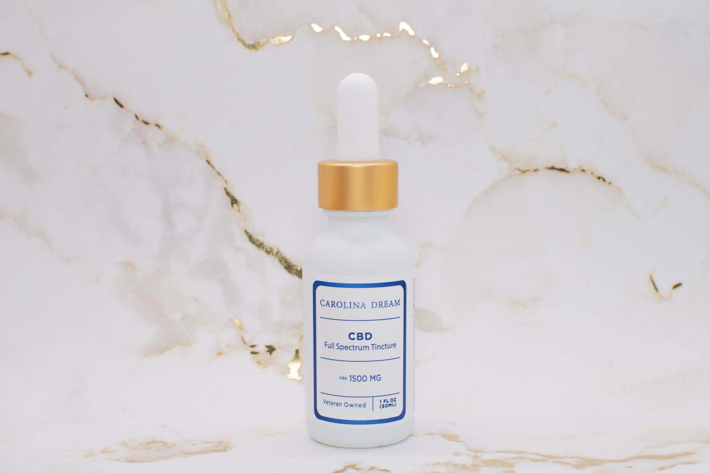 Full Spectrum 1500mg CBD Tincture bottle with dropper on marble background.
